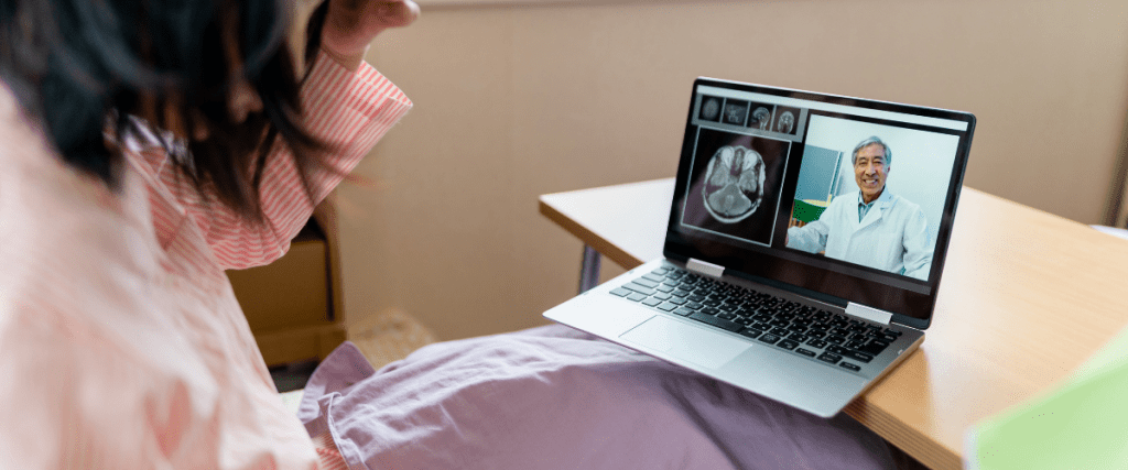 Patient talking with neurologist over computer