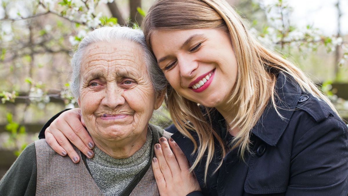 Blonde woman hugging grandmother